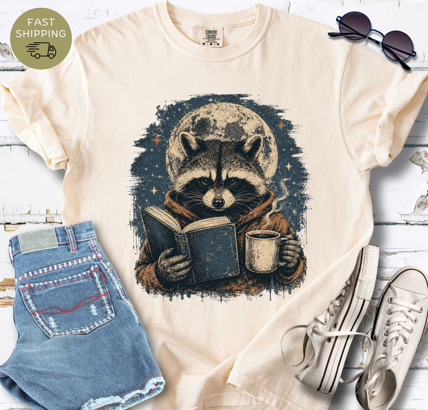 Bookish animal t-shirt styled with denim shorts, trainers, and sunglasses.