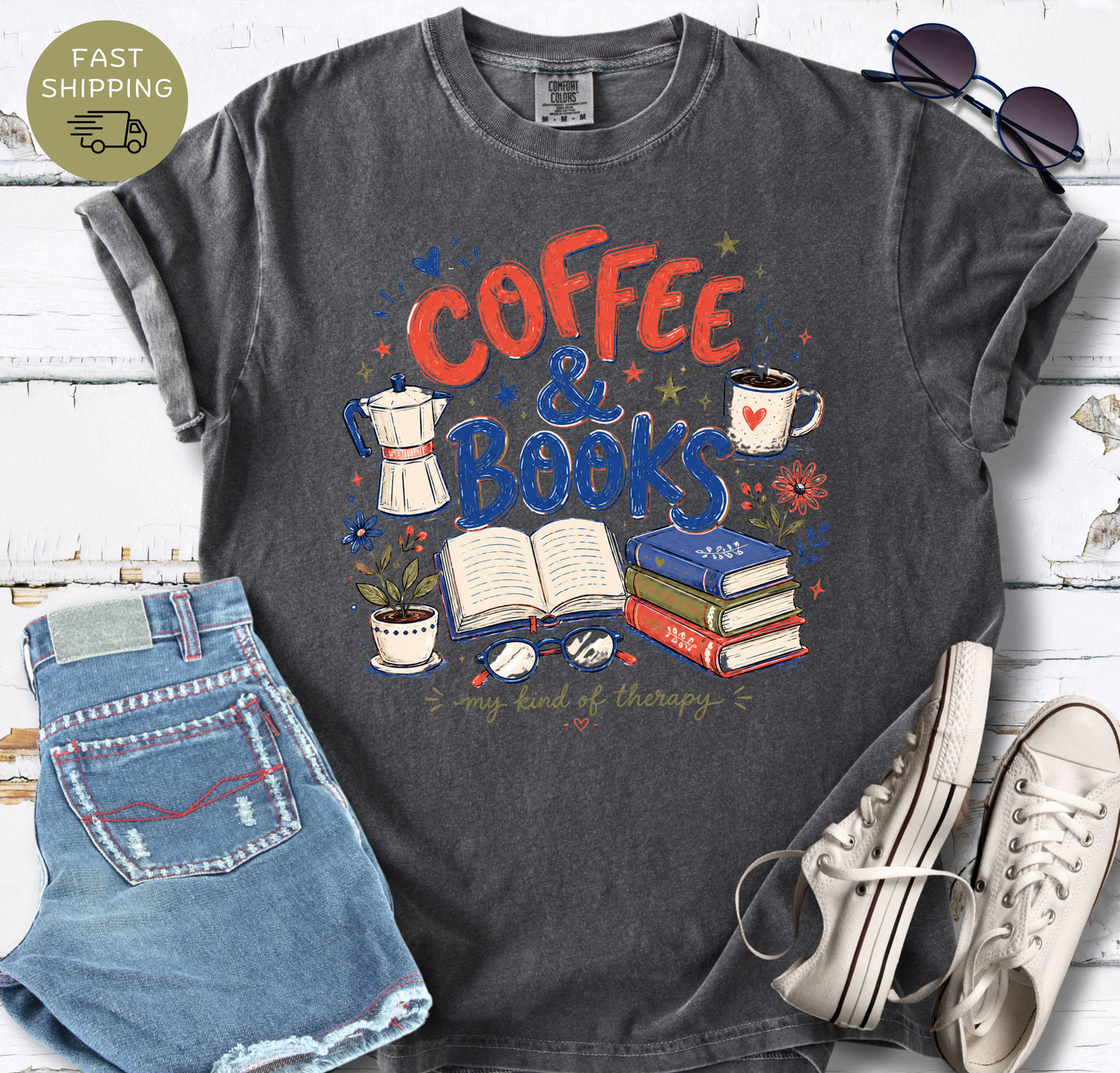 Book lover t-shirt featuring coffee cup, stacked books, open book, glasses, and flowers.