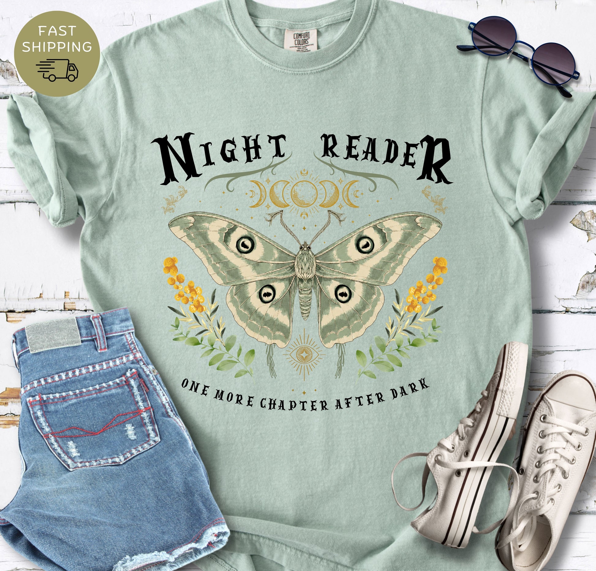 Women’s bookish T-shirt in bay styled with denim shorts, sunglasses and white trainers.