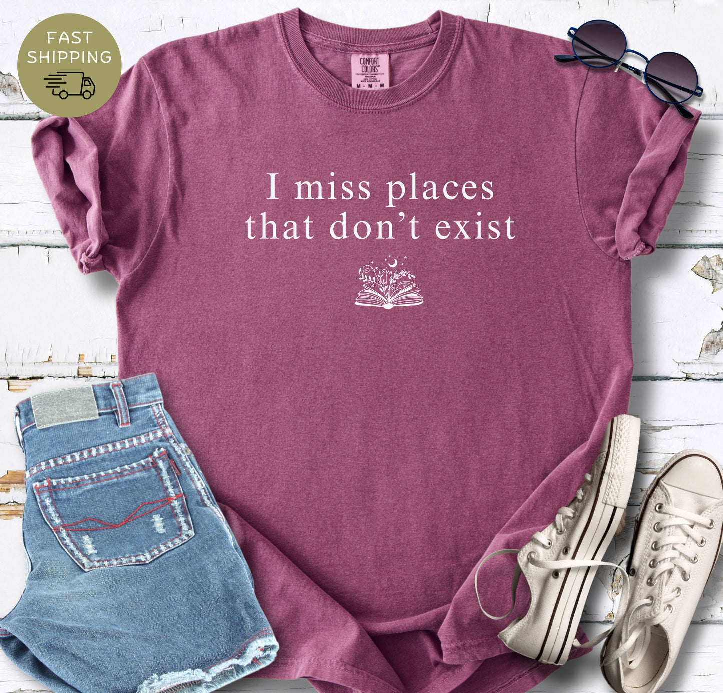 Minimalist book lover shirt with fictional worlds quote in berry color