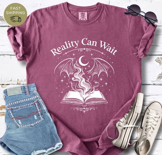 Reality Can Wait fantasy bookish t-shirt with open book and magical design on Comfort Colors 1717 berry