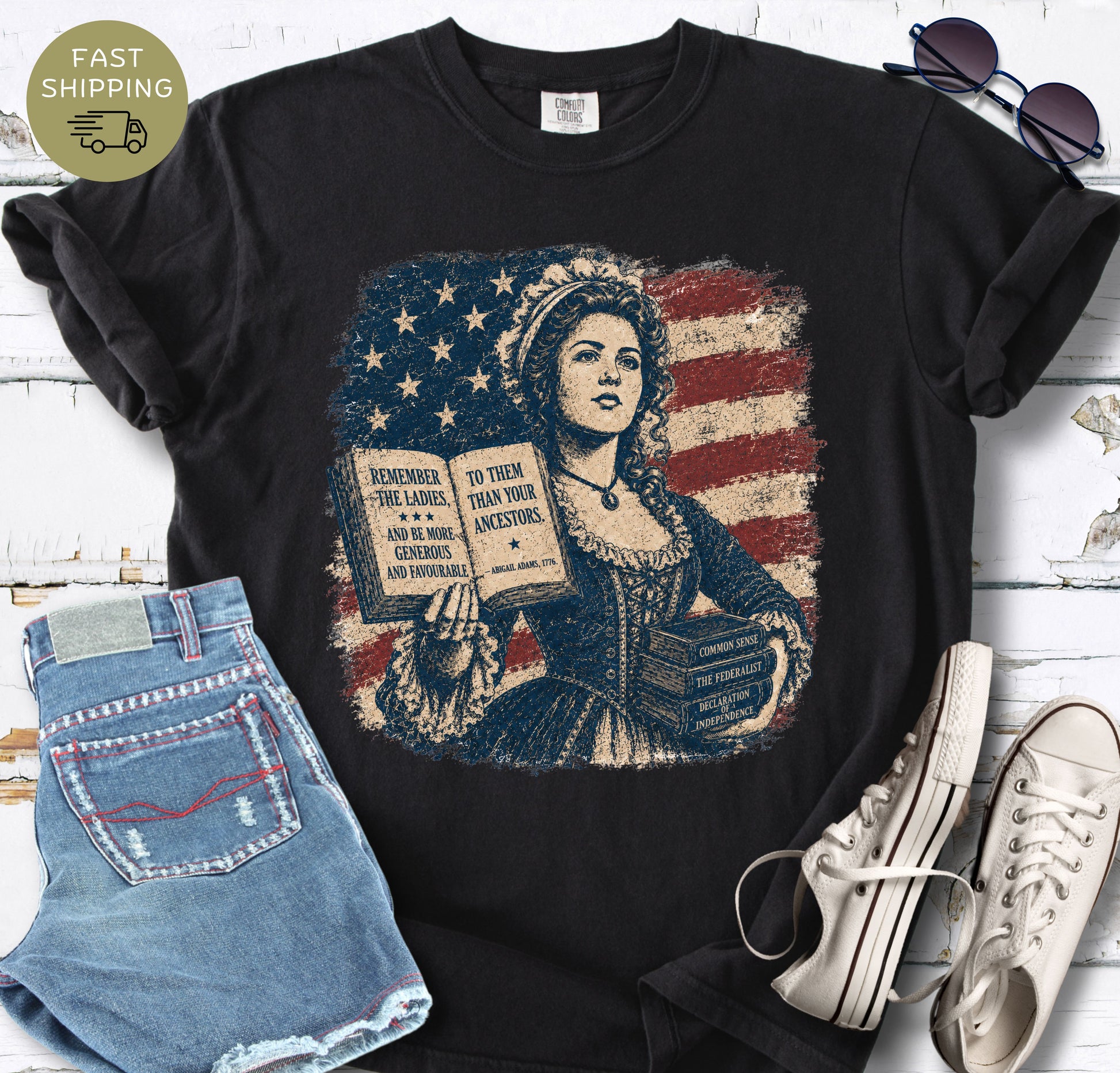 Black bookish t-shirt with a colonial woman, American flag, open book, and historic quote.