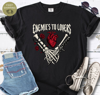 Romantasy reader shirt with skeletal hands, daggers, roses, and heart illustration