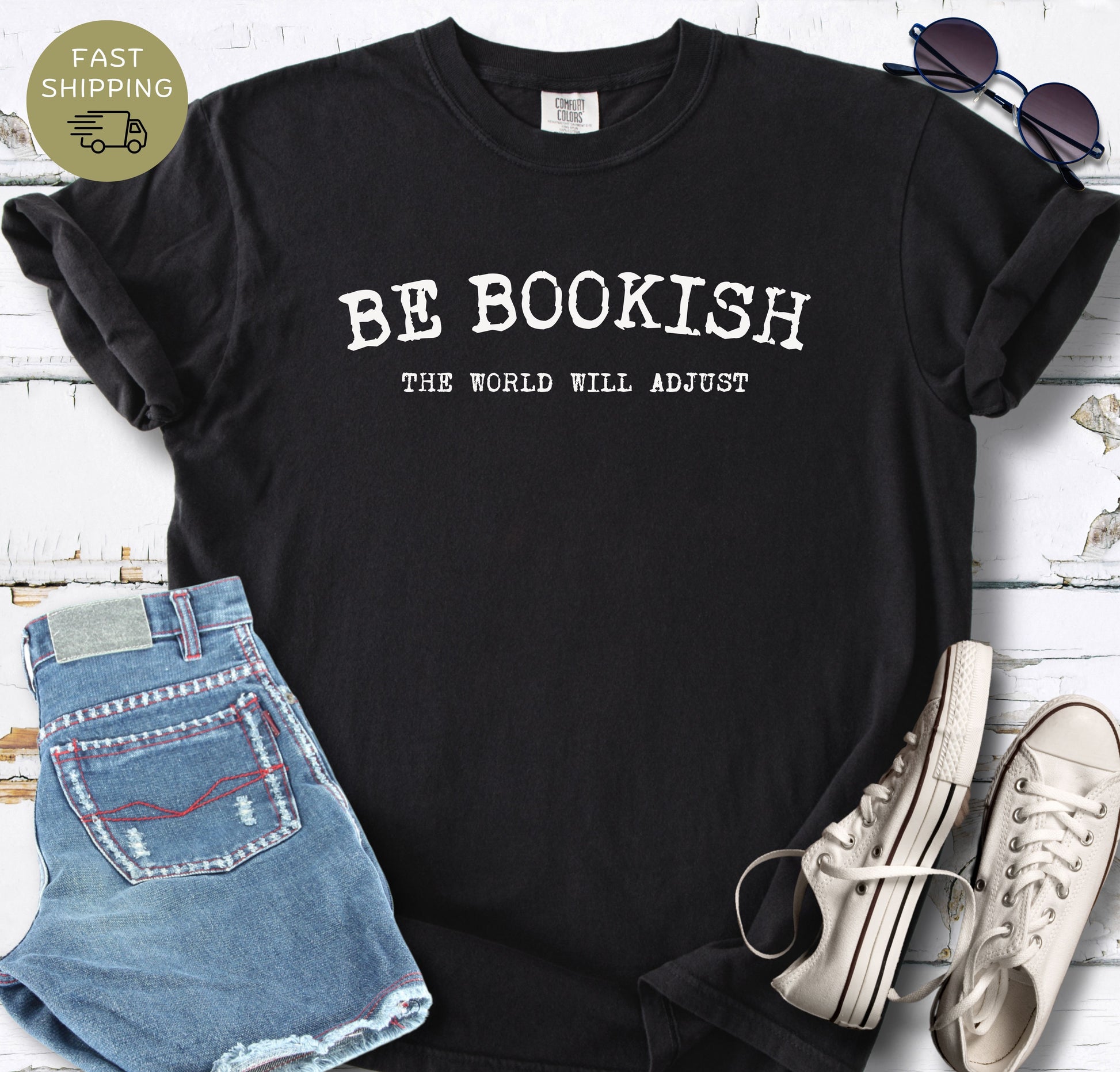 Minimal book lover shirt featuring the phrase Be Bookish The World Will Adjust.