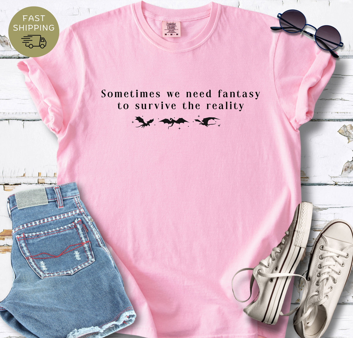 Minimal fantasy book lover tee with black typography and dragon silhouettes.
