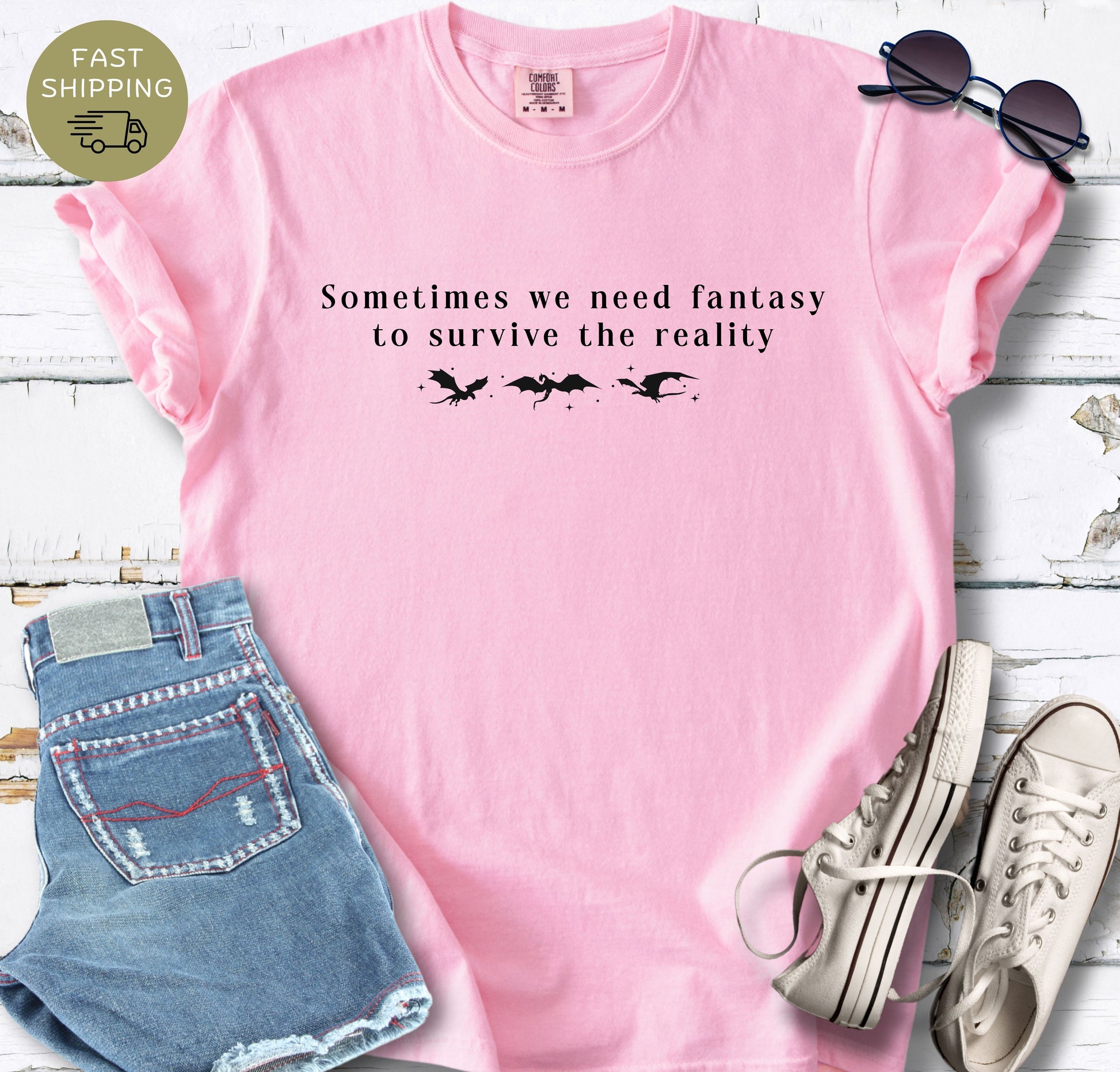 Minimal fantasy book lover tee with black typography and dragon silhouettes.