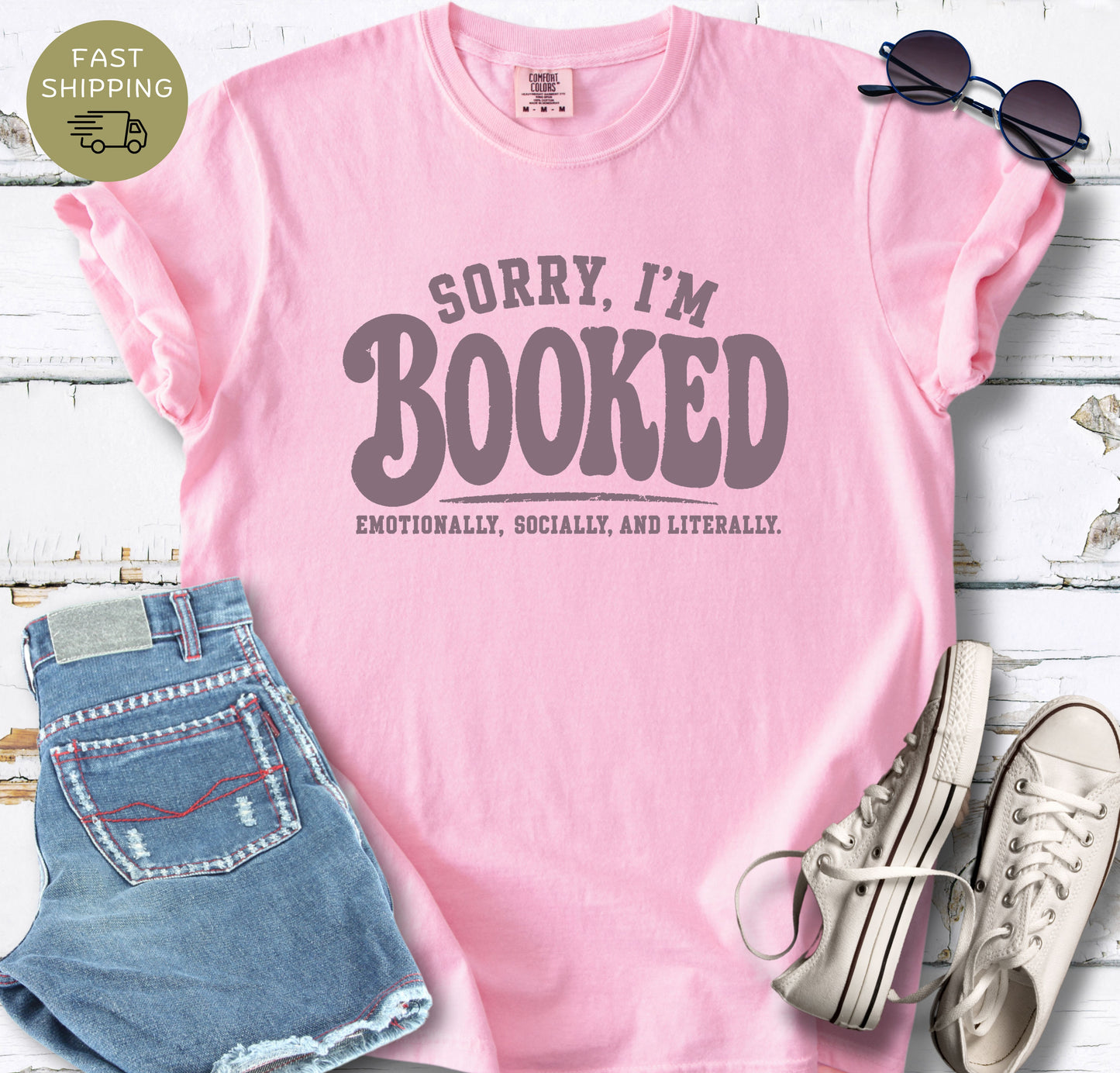 Funny book lover t-shirt that says Sorry I’m Booked emotionally socially and literally.