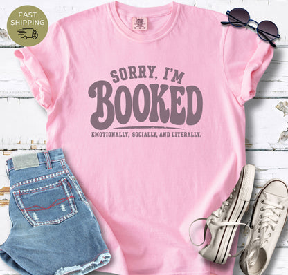 Funny book lover t-shirt that says Sorry I’m Booked emotionally socially and literally.