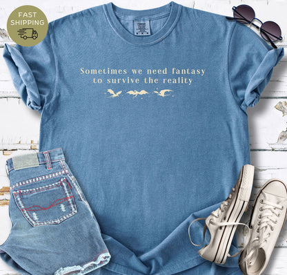 Comfort Colors blue jeans shirt with subtle dragon design for fantasy readers.