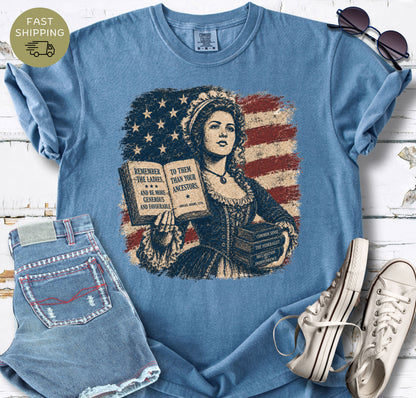 Women’s history graphic tee featuring books, a colonial portrait, and the Remember the Ladies quote.