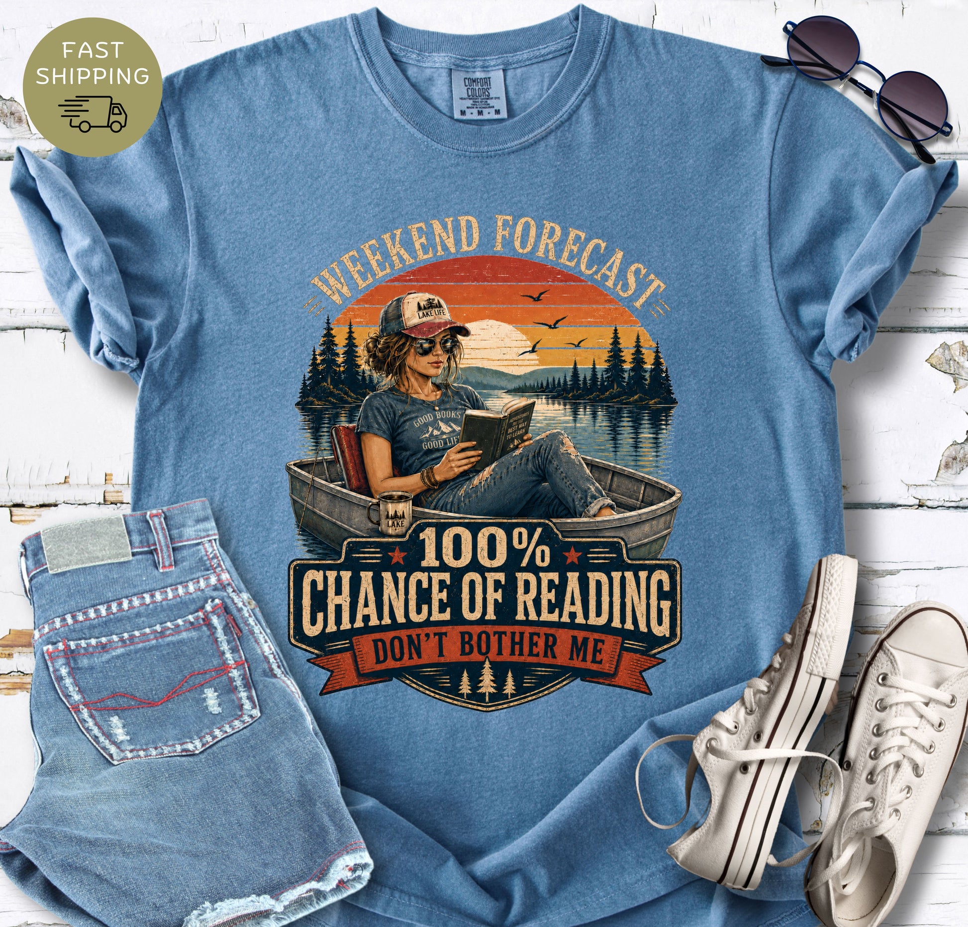 Women’s bookish T-shirt in mint styled with denim shorts, sunglasses and white trainers.