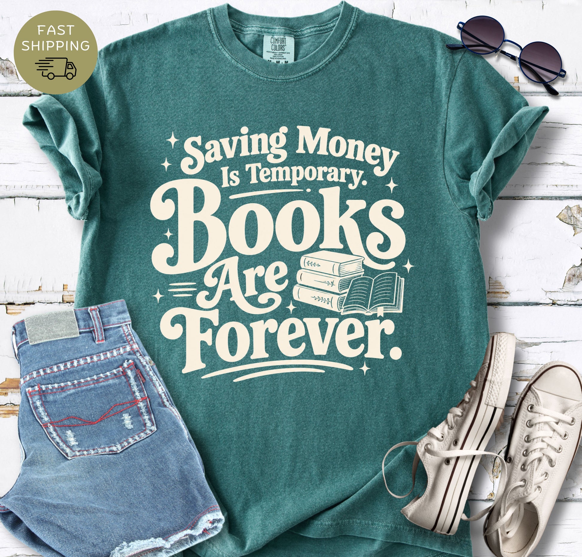 Casual lifestyle mockup of a blue spruce bookish tee with bold typography and book stack artwork.