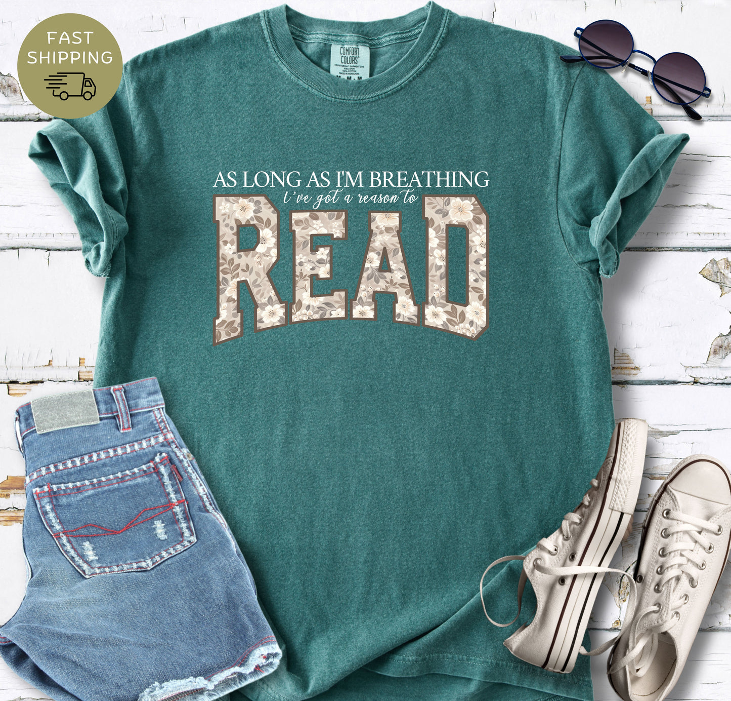 Book lover gift shirt featuring As Long As I’m Breathing I’ve Got a Reason to Read in a feminine floral design.