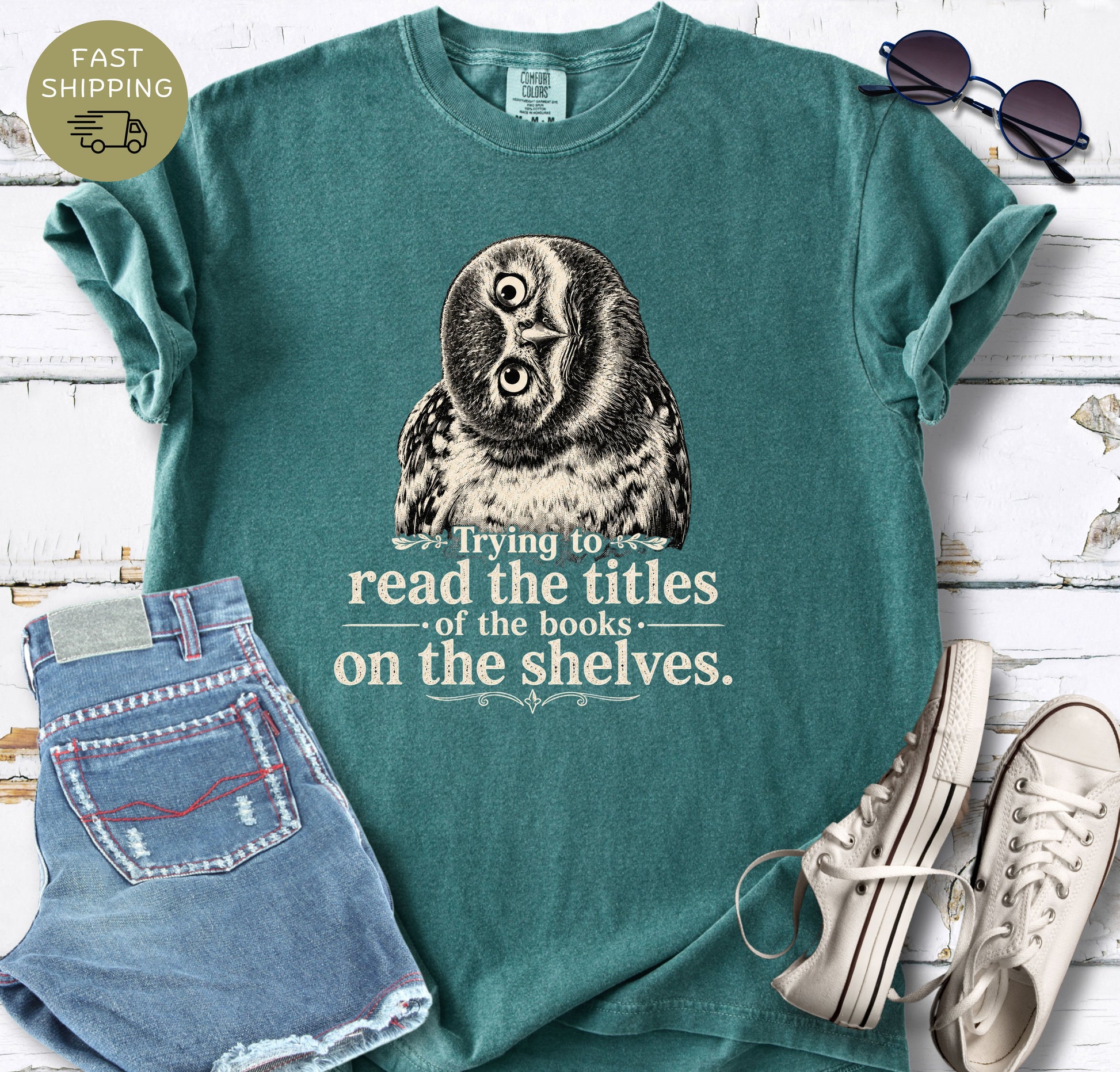Casual lifestyle mockup of a Blue Jean bookish tee with owl artwork and vintage-style typography.