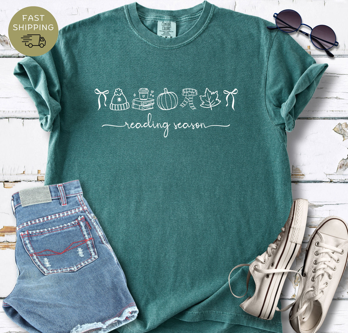 Reading season shirt styled with denim shorts, white trainers, and sunglasses.