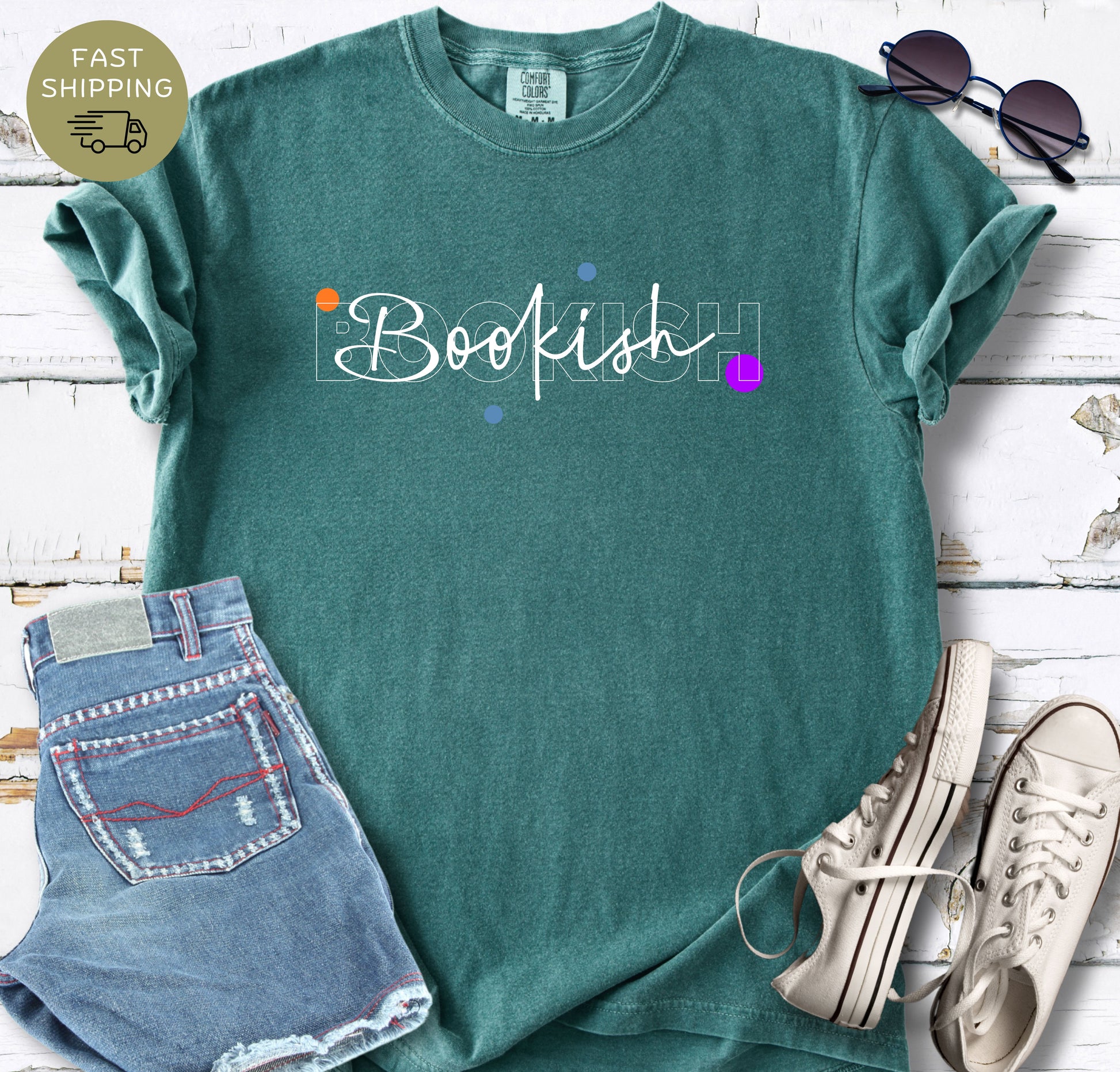 Women’s bookish T-shirt in black styled with denim shorts, sunglasses and white trainers.