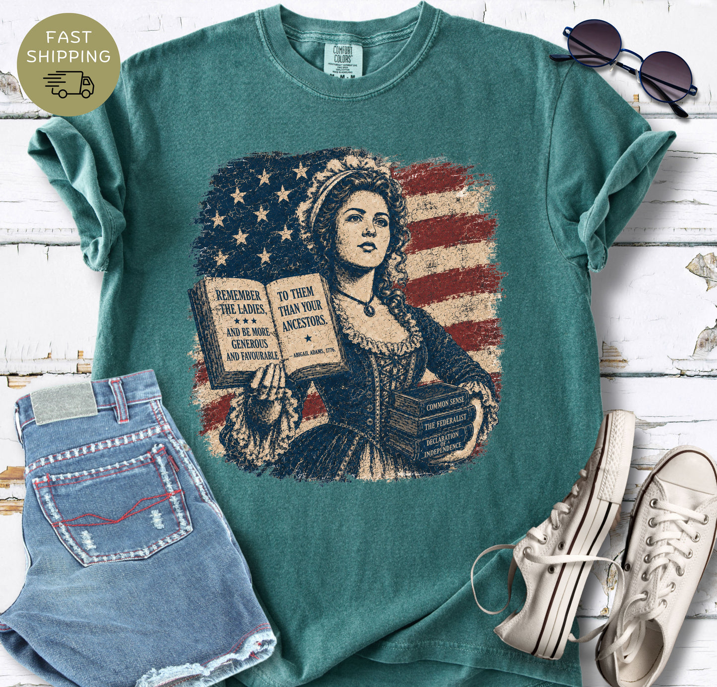 Vintage-style American history t-shirt with Common Sense, The Federalist, and Declaration of Independence books.