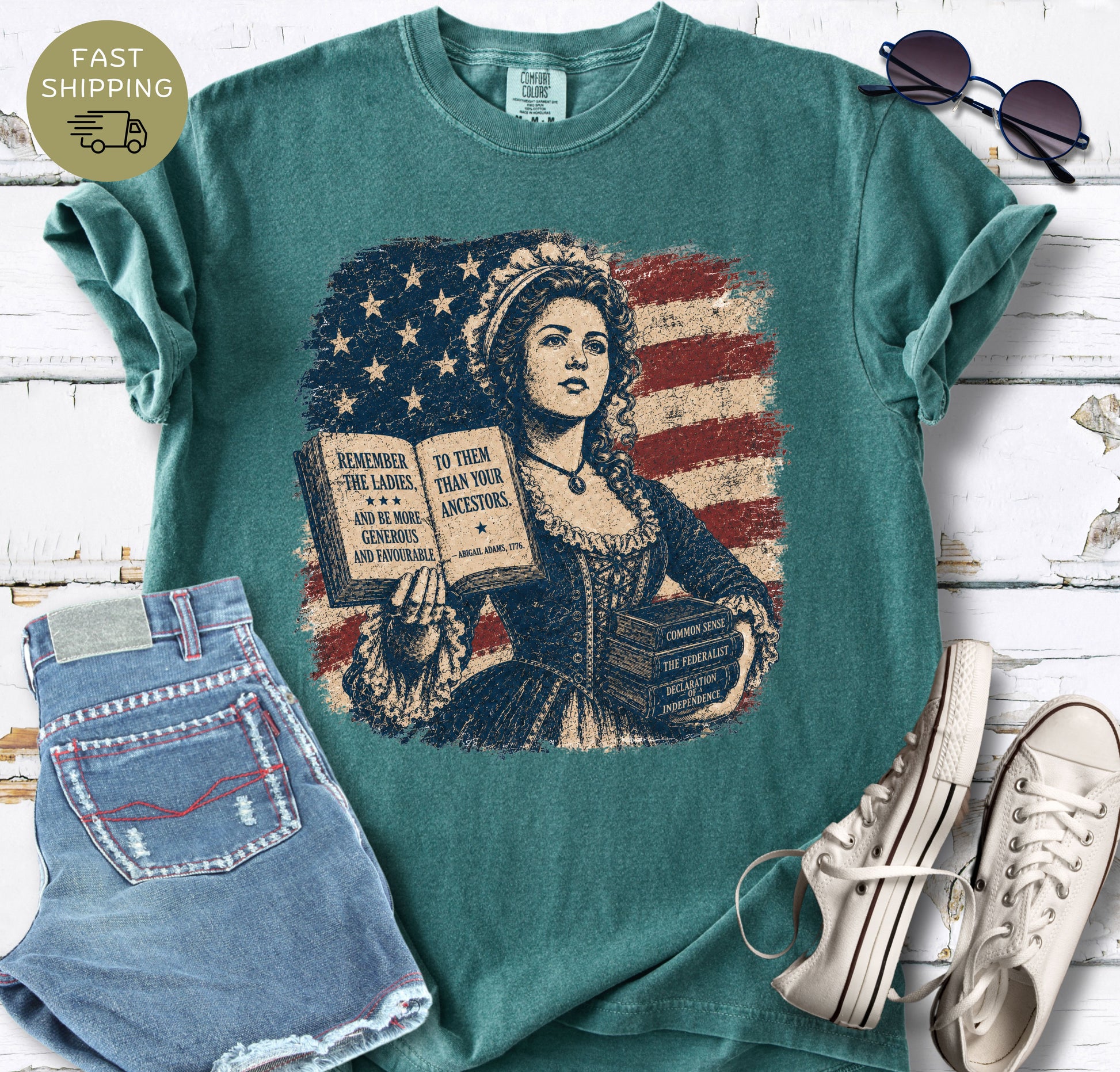 Vintage-style American history t-shirt with Common Sense, The Federalist, and Declaration of Independence books.