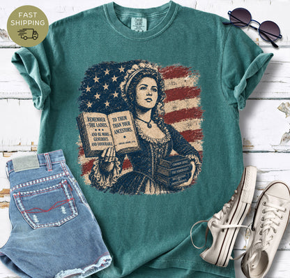 Vintage-style American history t-shirt with Common Sense, The Federalist, and Declaration of Independence books.