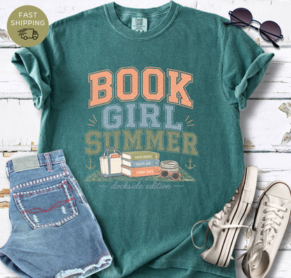 Summer book lover tee with beach aesthetic and stacked books illustration