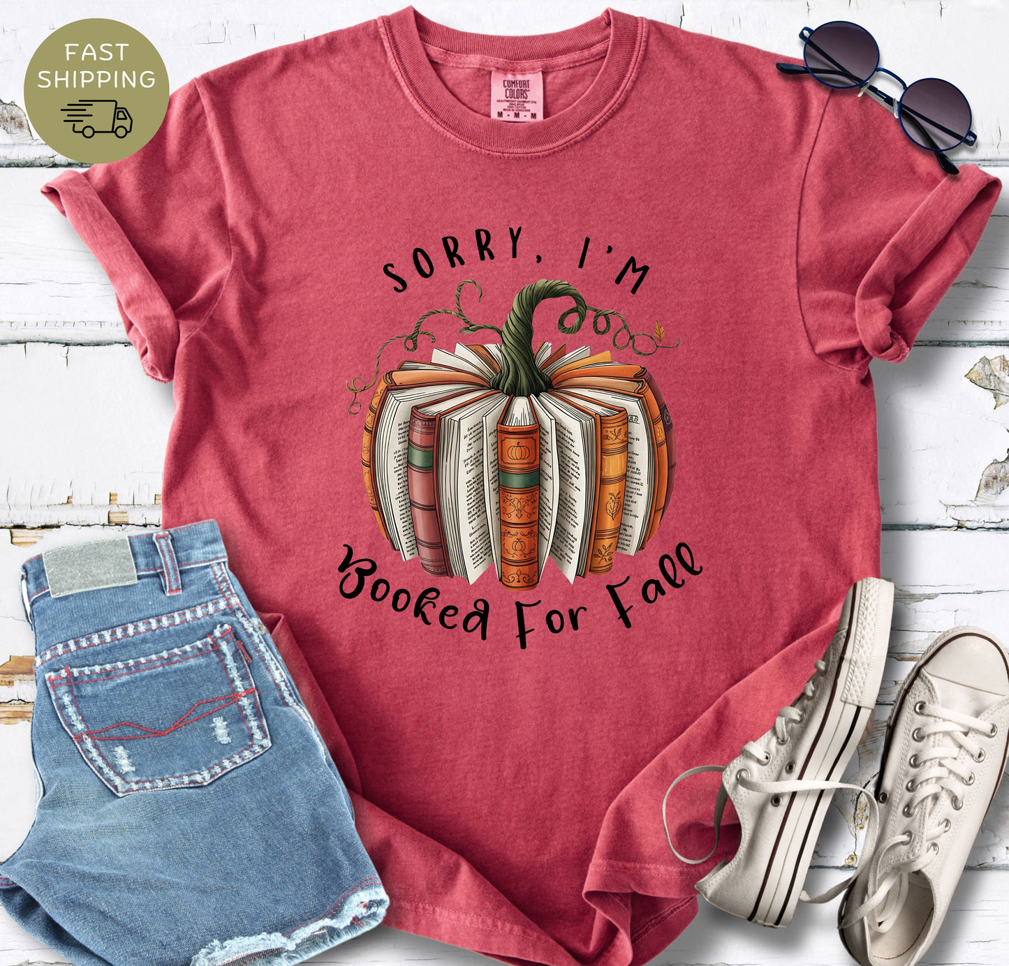 Cosy reader gift shirt featuring a pumpkin-shaped stack of books.