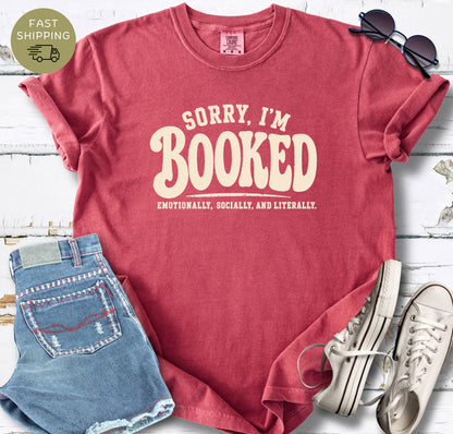 Cream text book lover shirt on a crimson garment-dyed Comfort Colors tee.