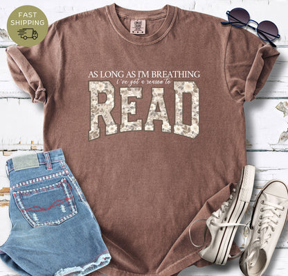 Close-up of a floral bookish design printed on a espresso garment-dyed Comfort Colors shirt.