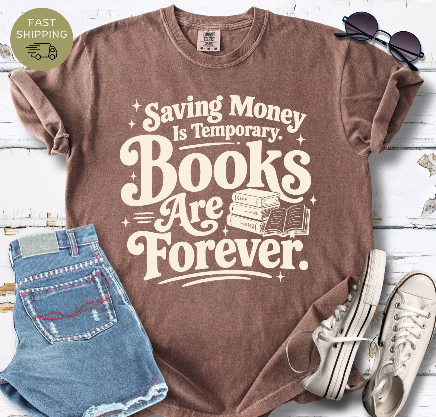 Book lover graphic tee with bold cream retro lettering and a small stack of books illustration.