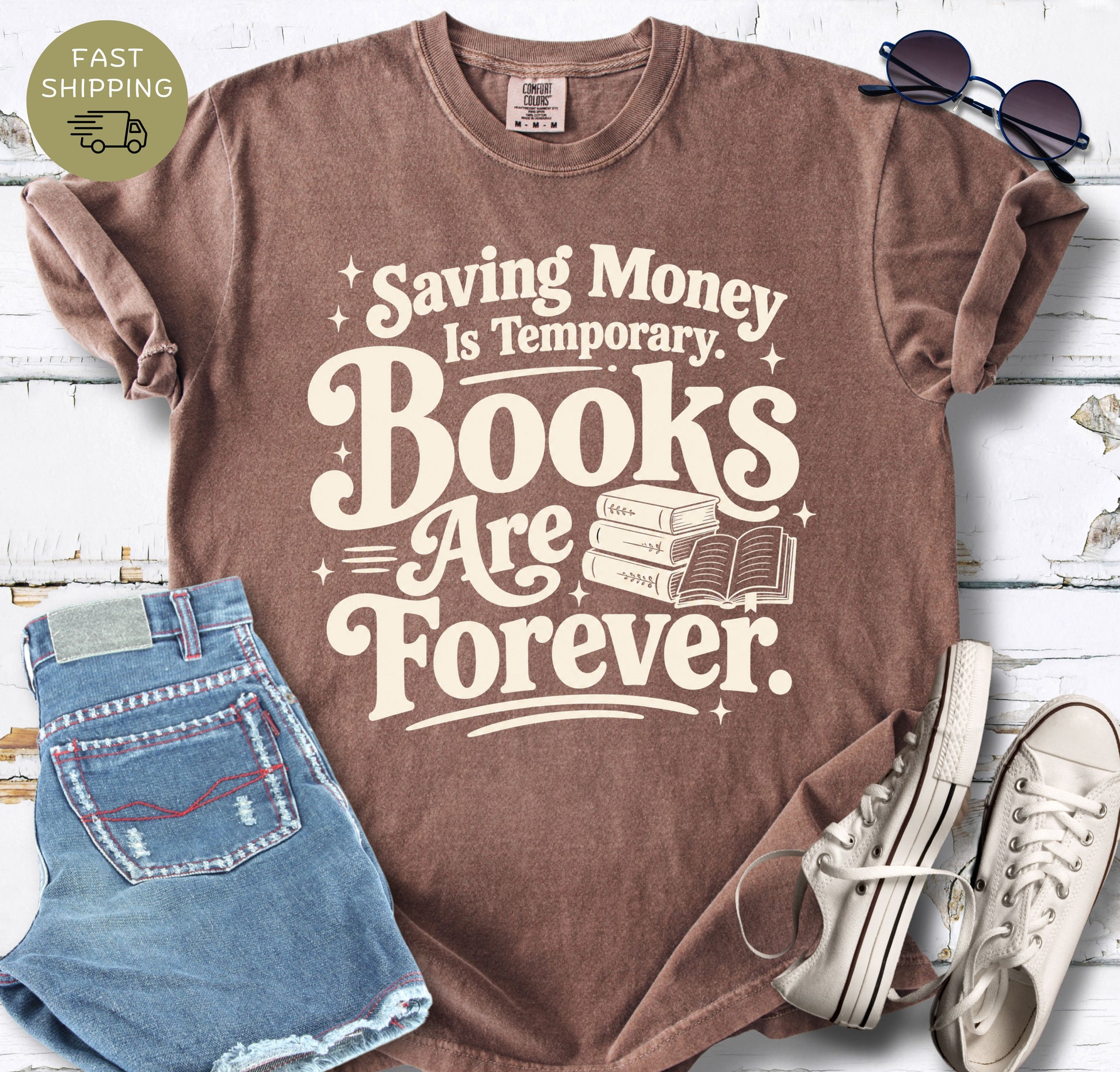 Book lover graphic tee with bold cream retro lettering and a small stack of books illustration.