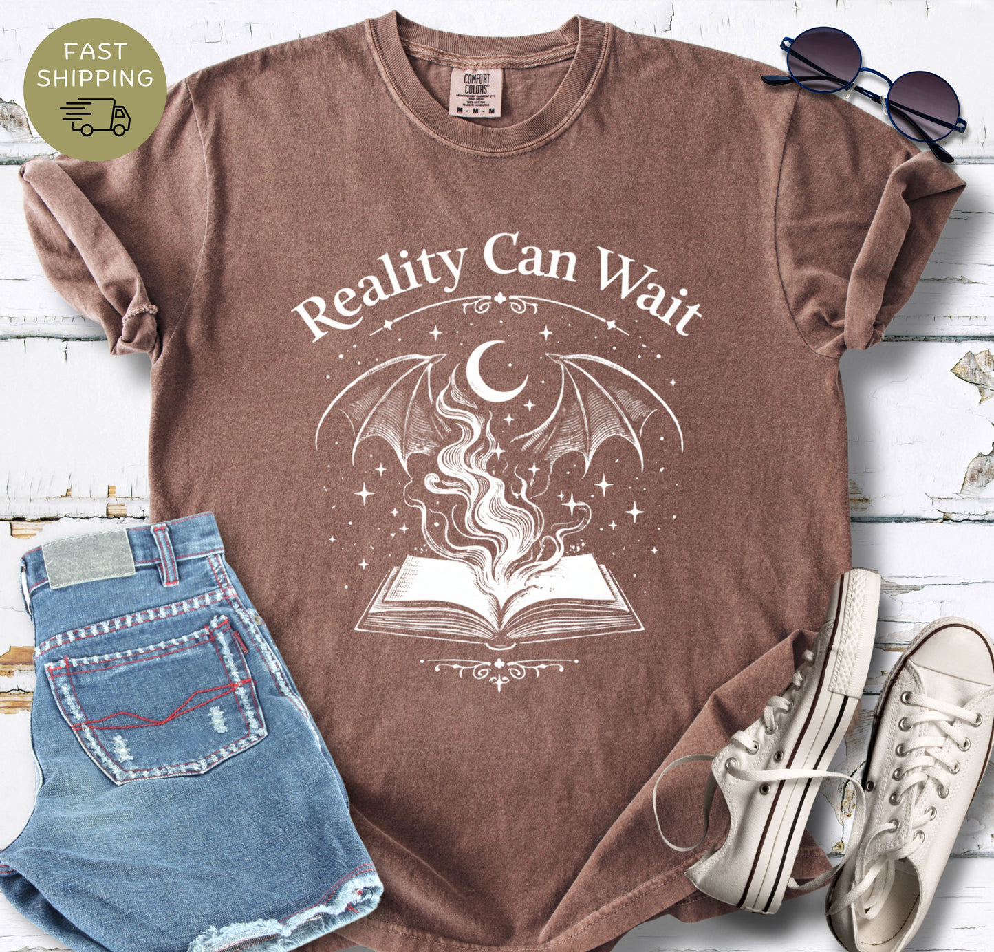Reality Can Wait fantasy bookish t-shirt with open book and magical design on Comfort Colors 1717 espresso