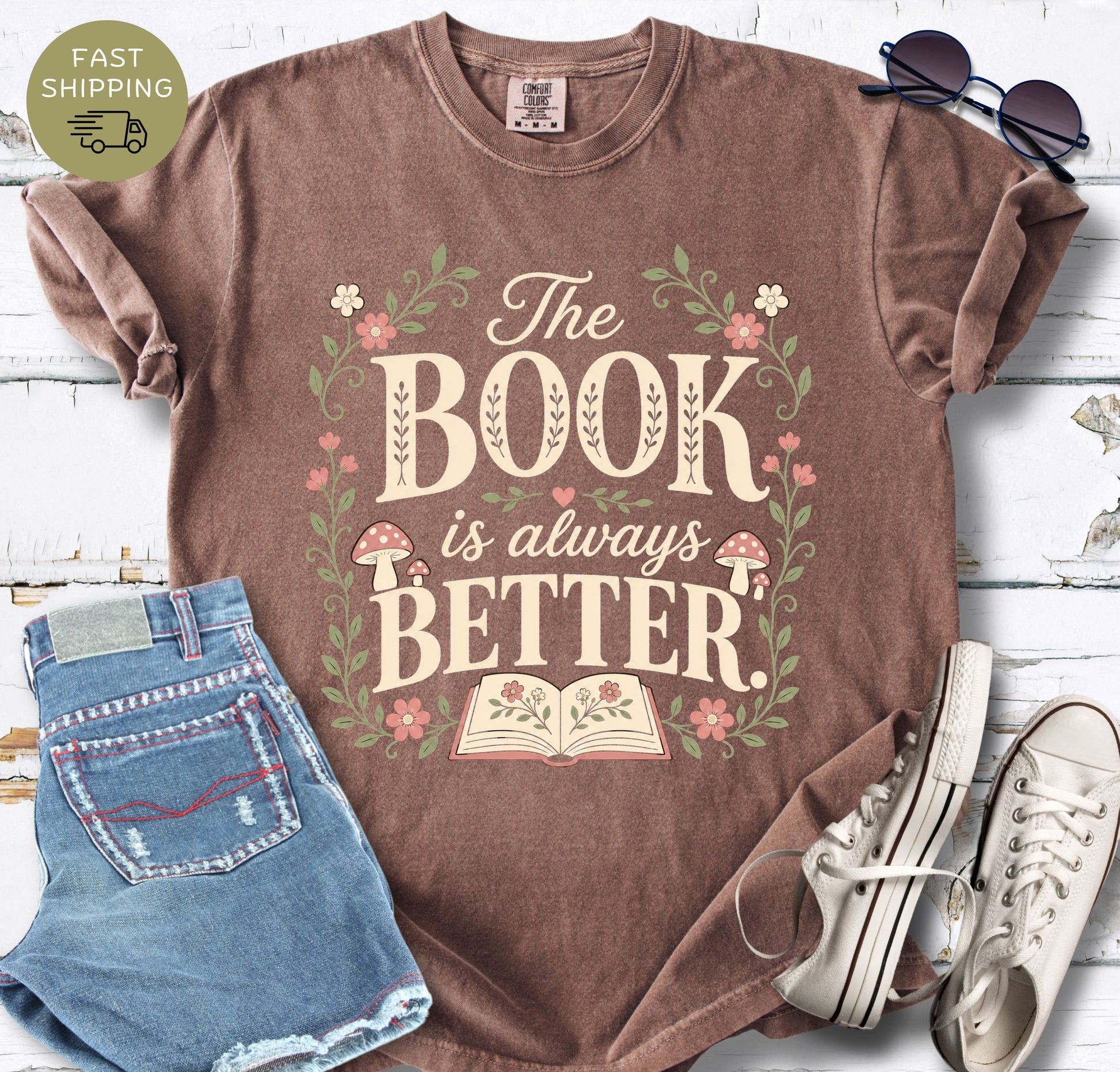 Comfort Colors t-shirt with “The Book Is Always Better” floral book lover design