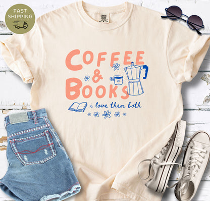 Ivory Comfort Colors T-shirt featuring the phrase “Coffee & Books, I Love Them Both” in coral and white lettering.