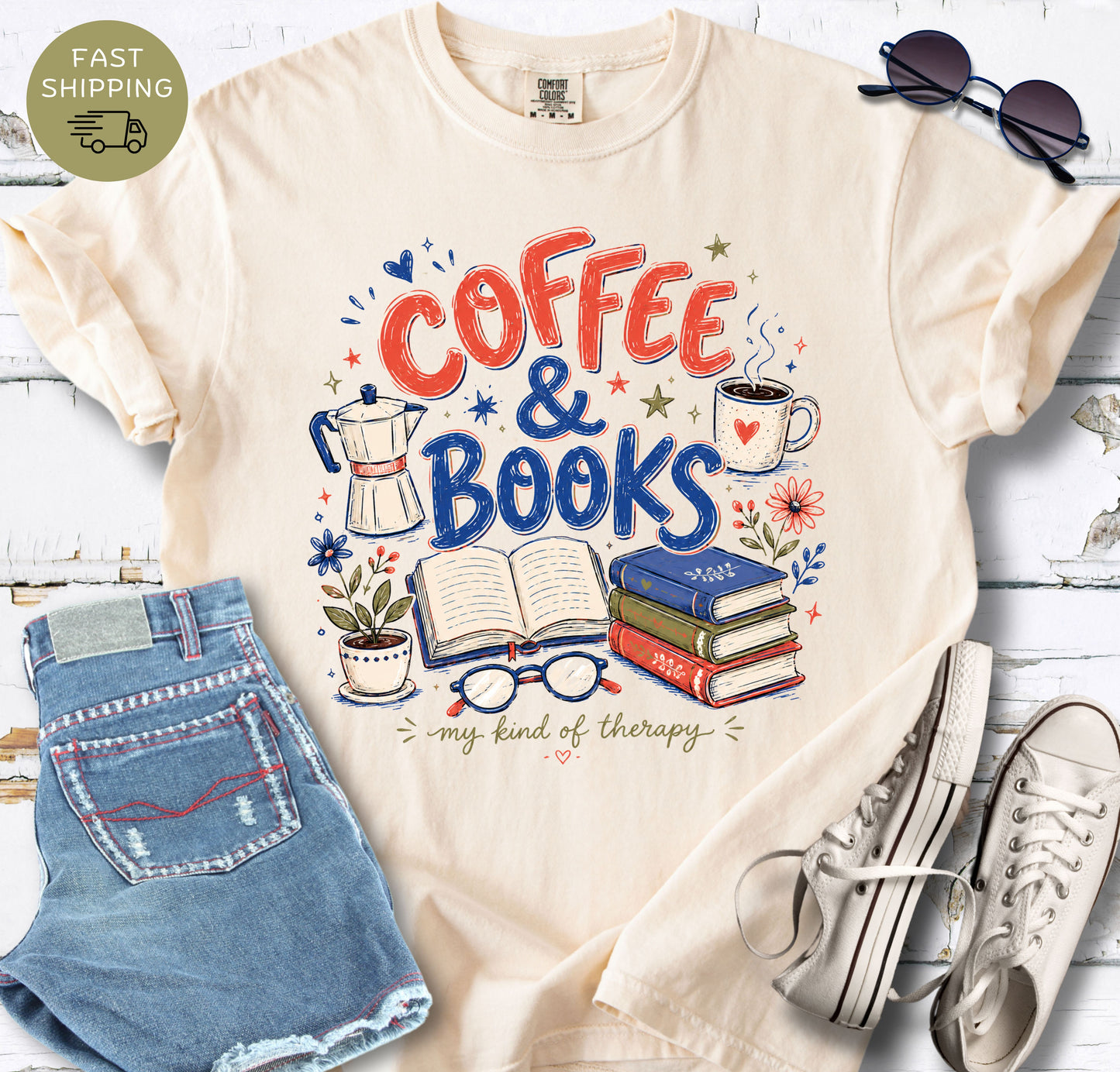 Ivory book lover tee with hand-drawn coffee and books design for cozy reading days.

