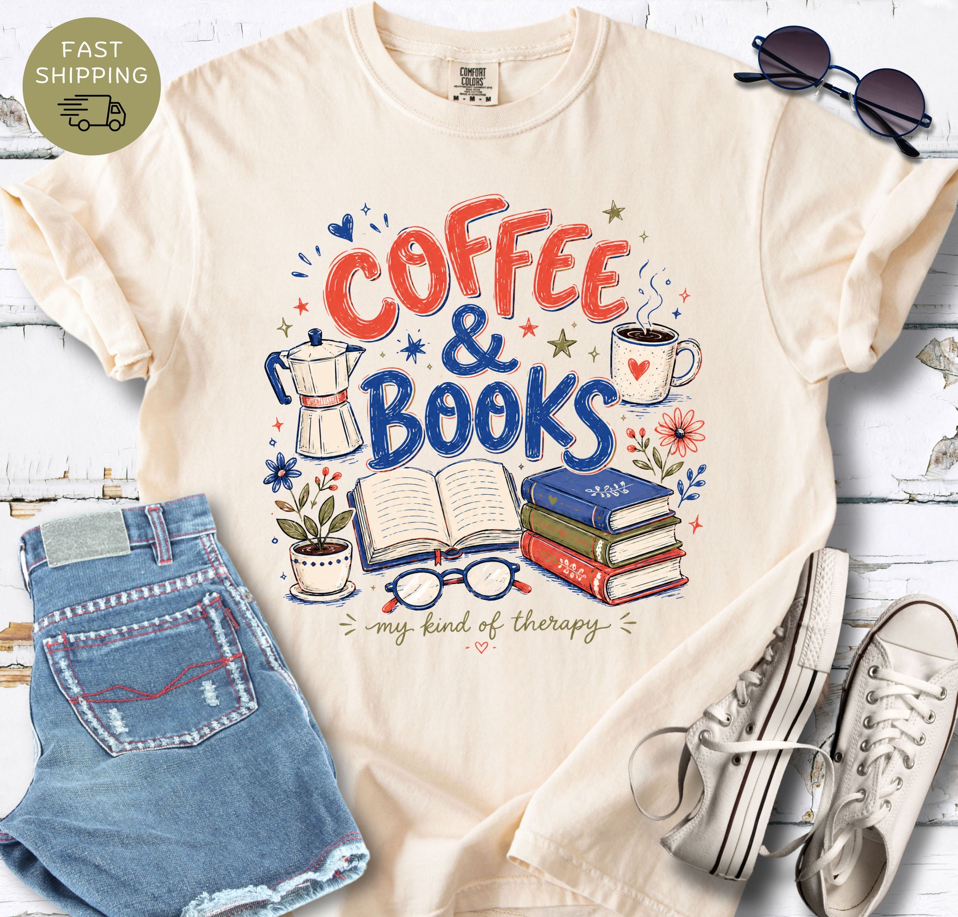 Ivory book lover tee with hand-drawn coffee and books design for cozy reading days.

