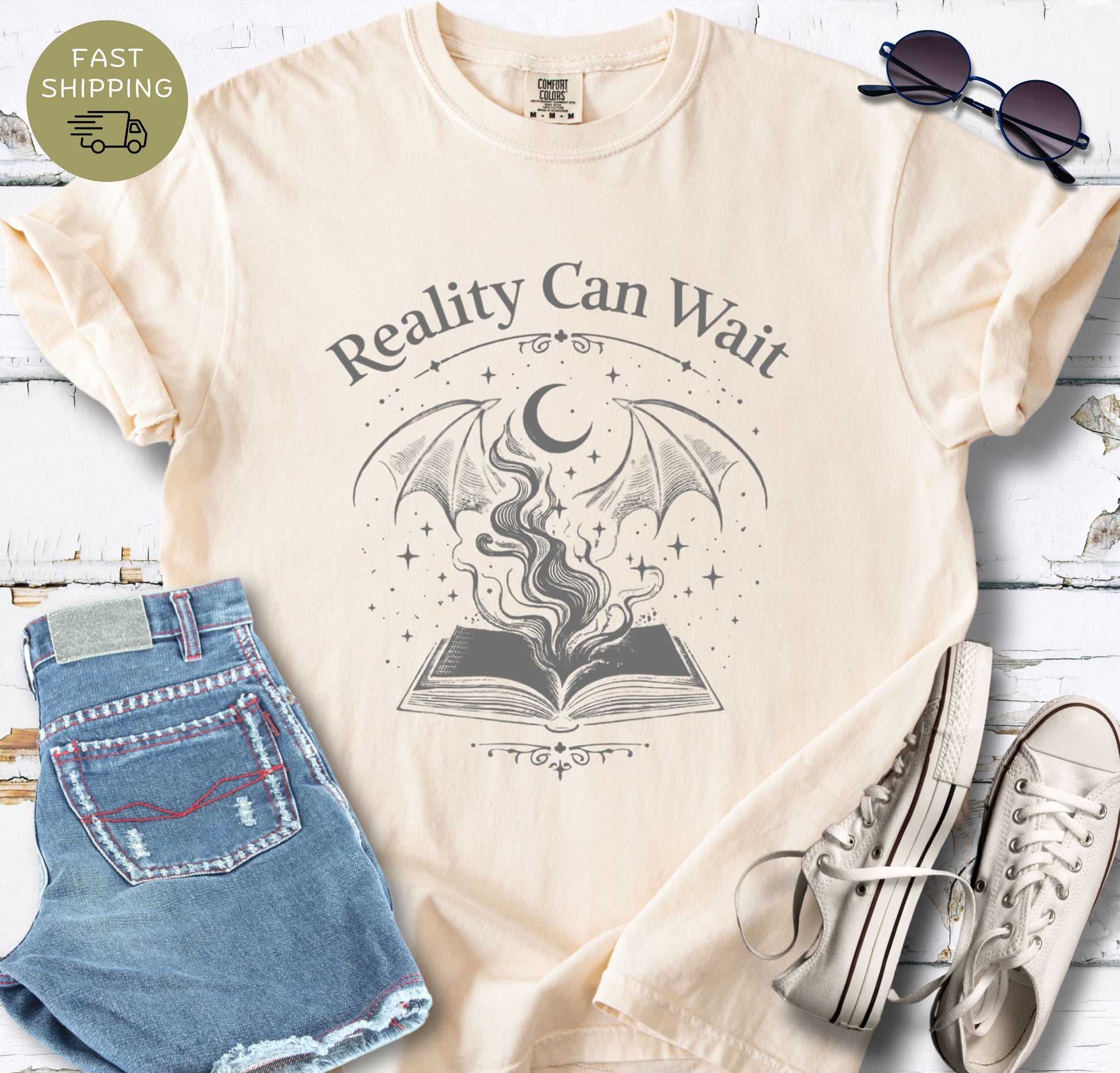 Reality Can Wait fantasy bookish t-shirt with open book and magical design on Comfort Colors 1717 ivory