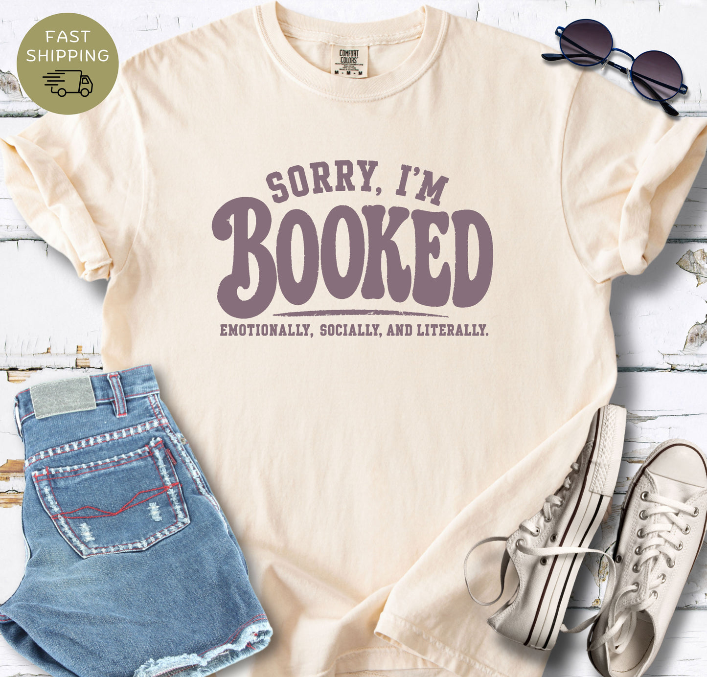 Funny reading shirt with Sorry I’m Booked quote for cozy bookstore and library days.