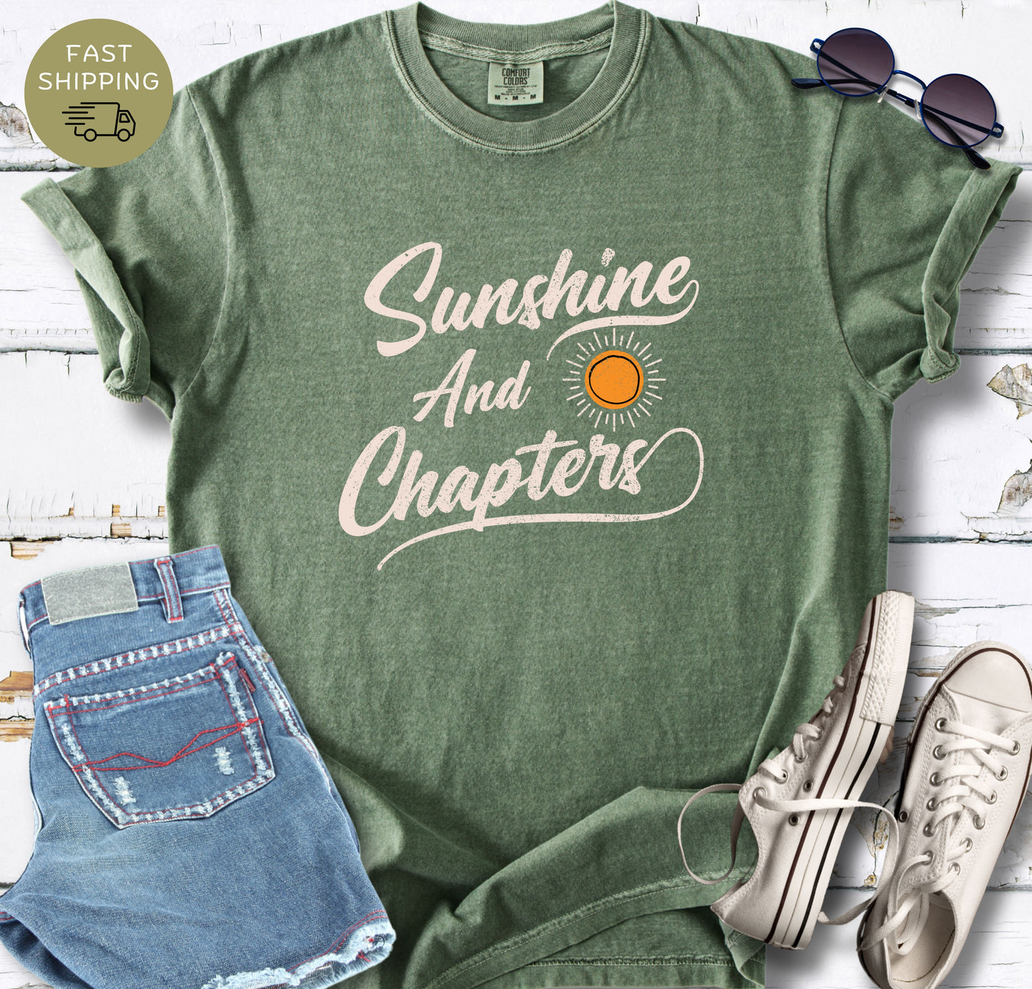 Gift for book lovers: A vintage-style moss t-shirt with a "Sunshine and Chapters" bookish quote.