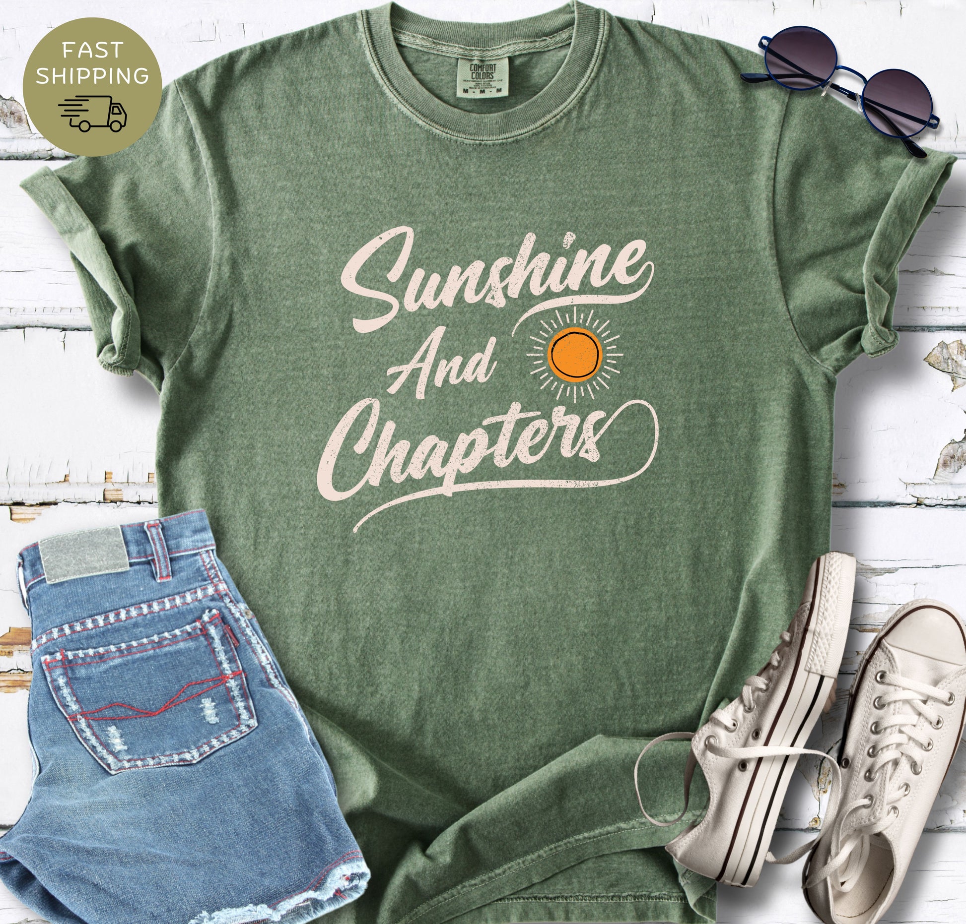 Gift for book lovers: A vintage-style moss t-shirt with a "Sunshine and Chapters" bookish quote.