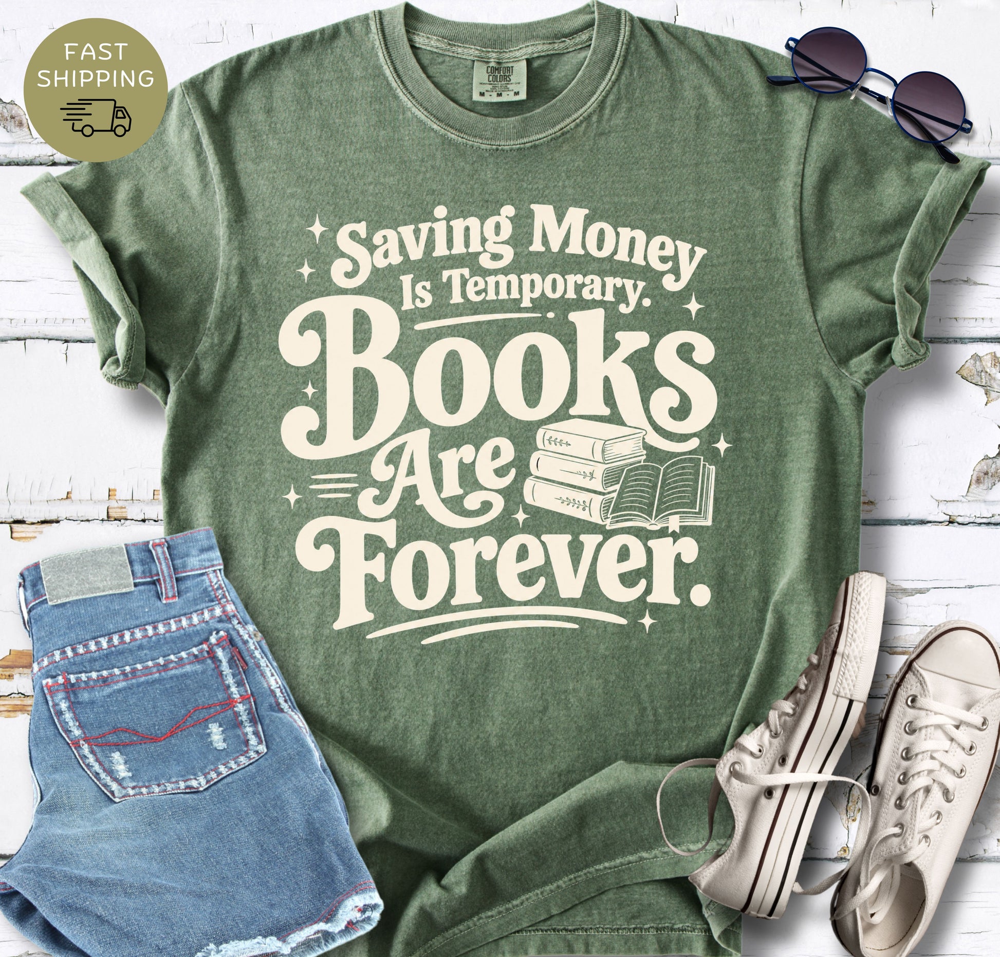 Reader gift shirt featuring cream lettering, spark accents and an open book illustration.