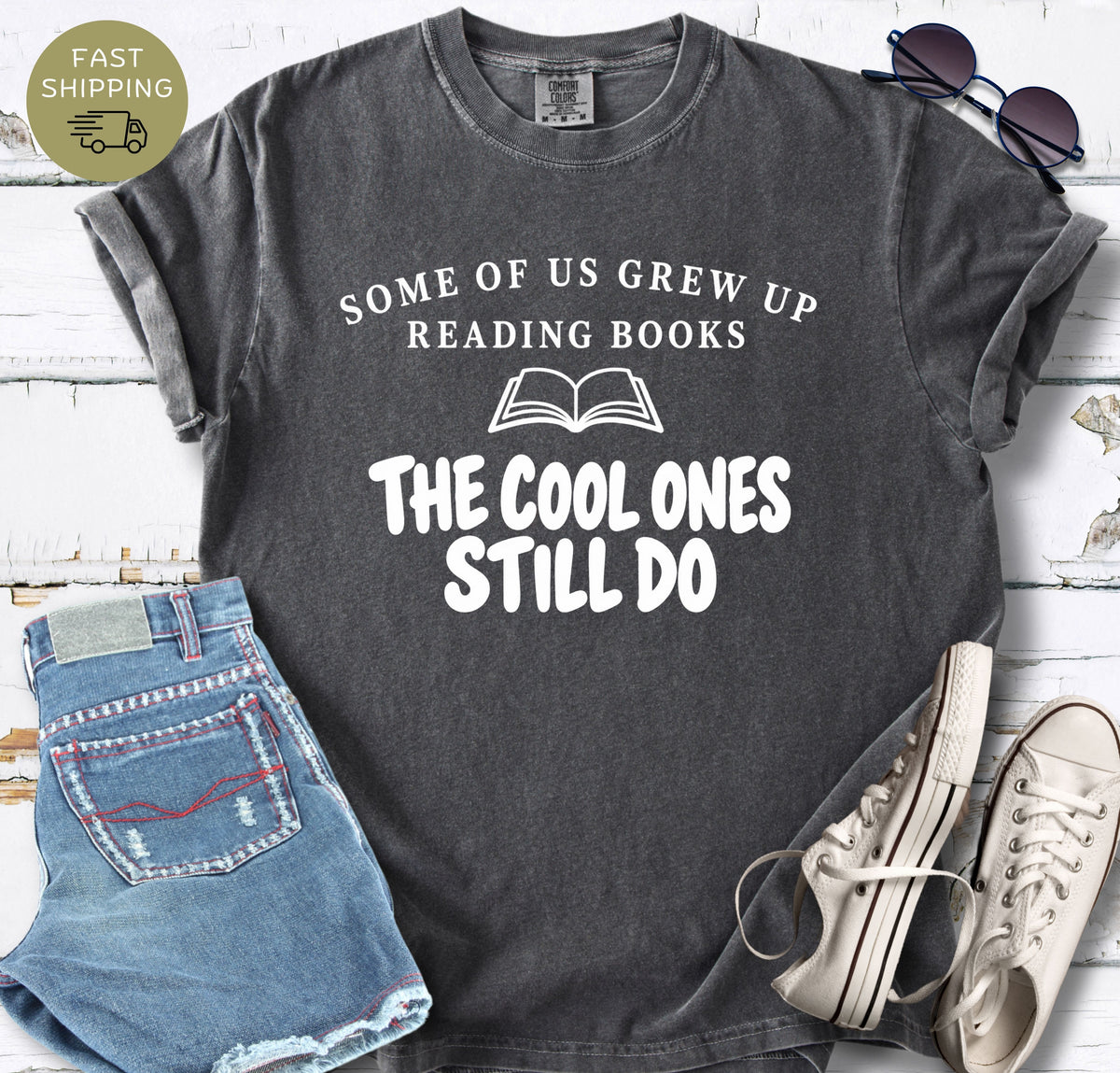 BookTok-inspired book lover tee styled with denim shorts, white trainers, and sunglasses.