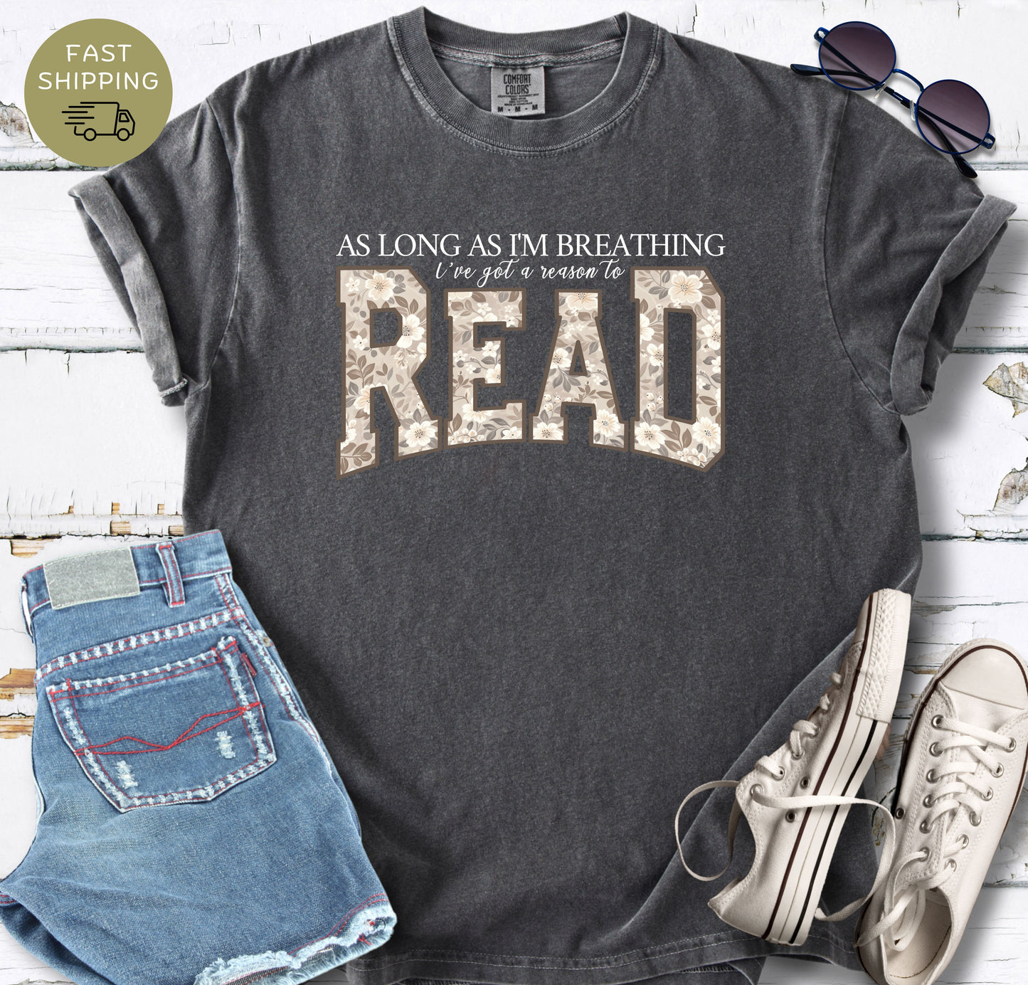 Floral reading quote shirt in berry with oversized botanical lettering spelling READ.