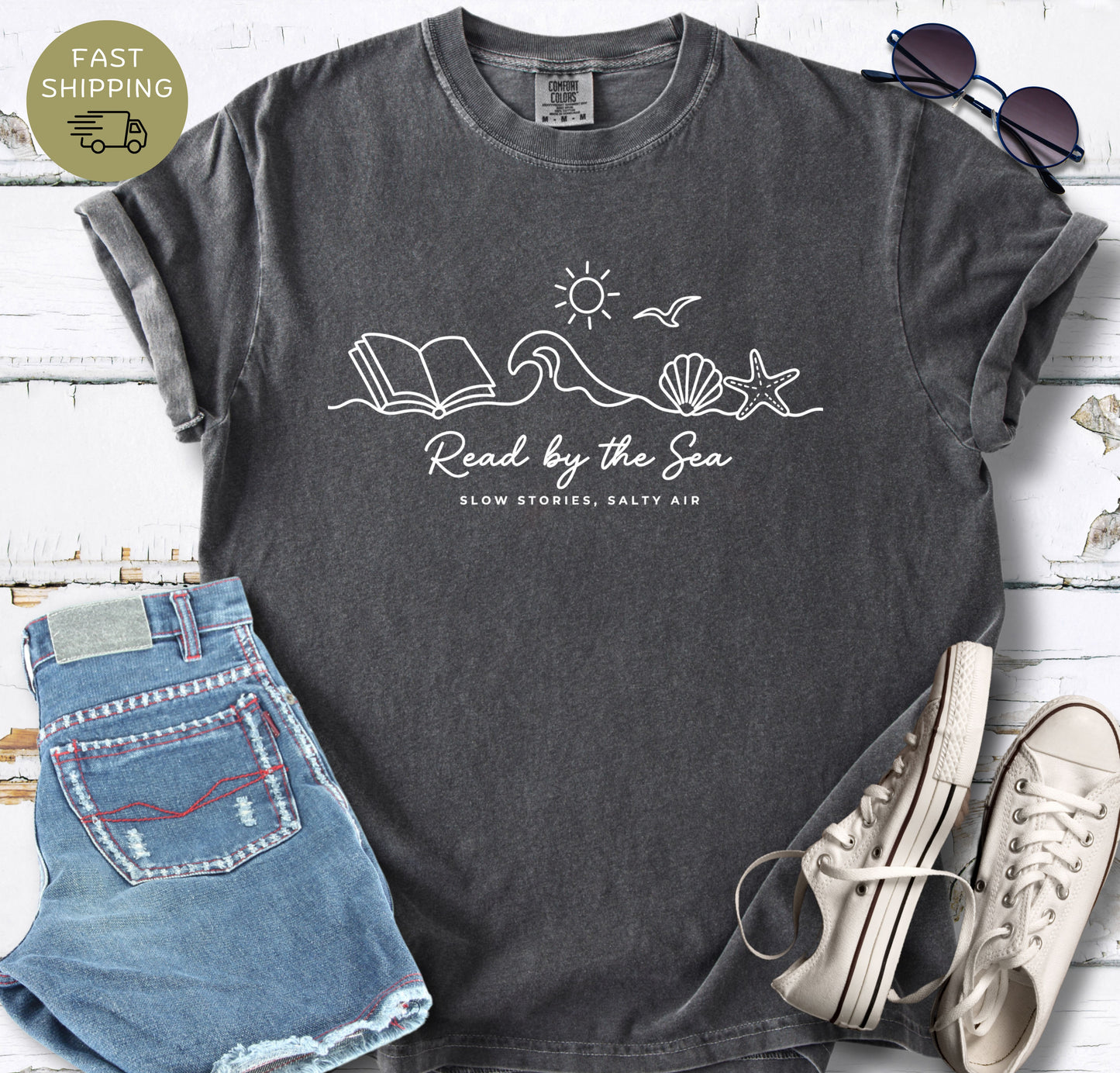 Minimalist coastal bookish tee with line art wave and open book