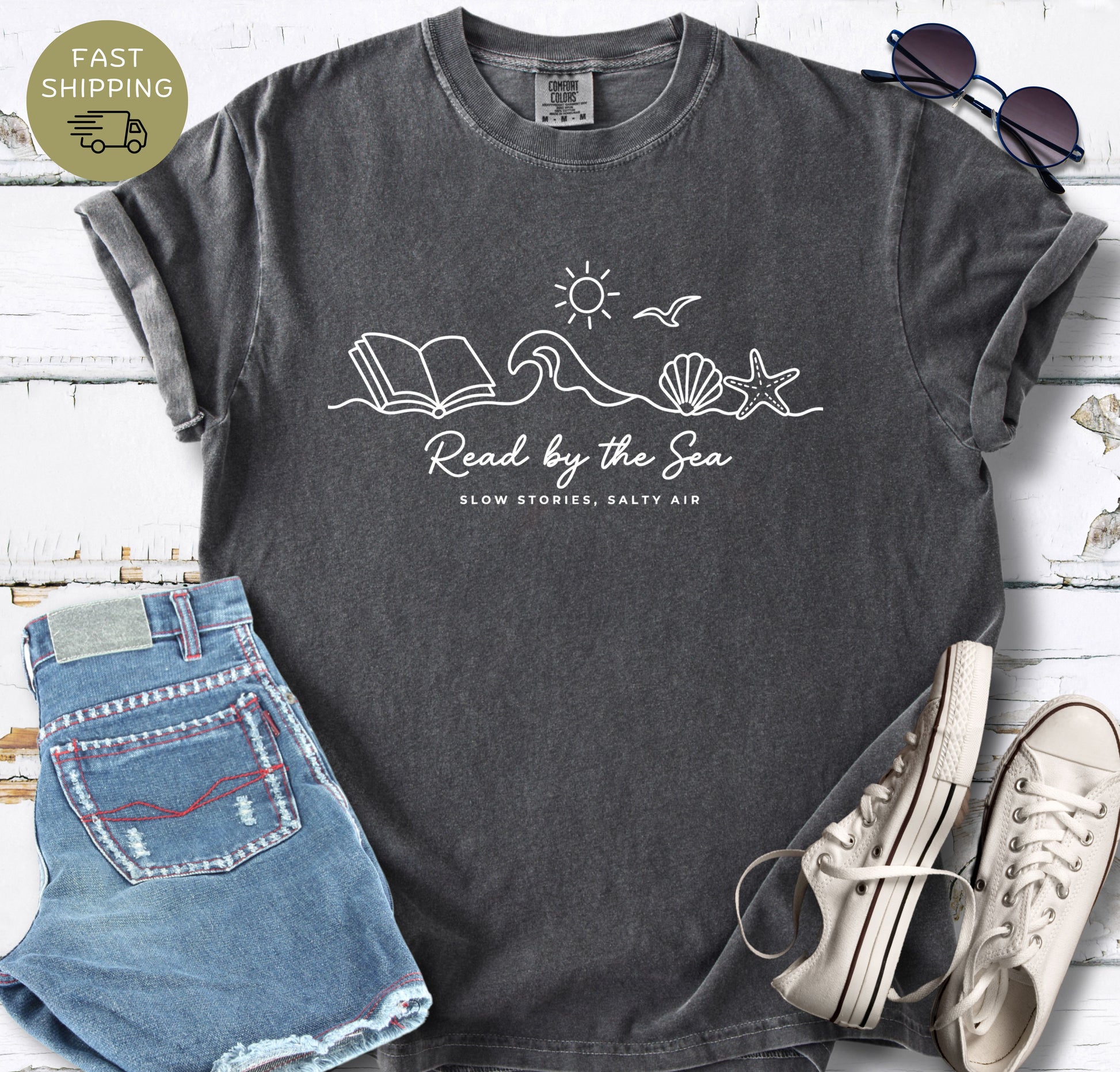 Minimalist coastal bookish tee with line art wave and open book