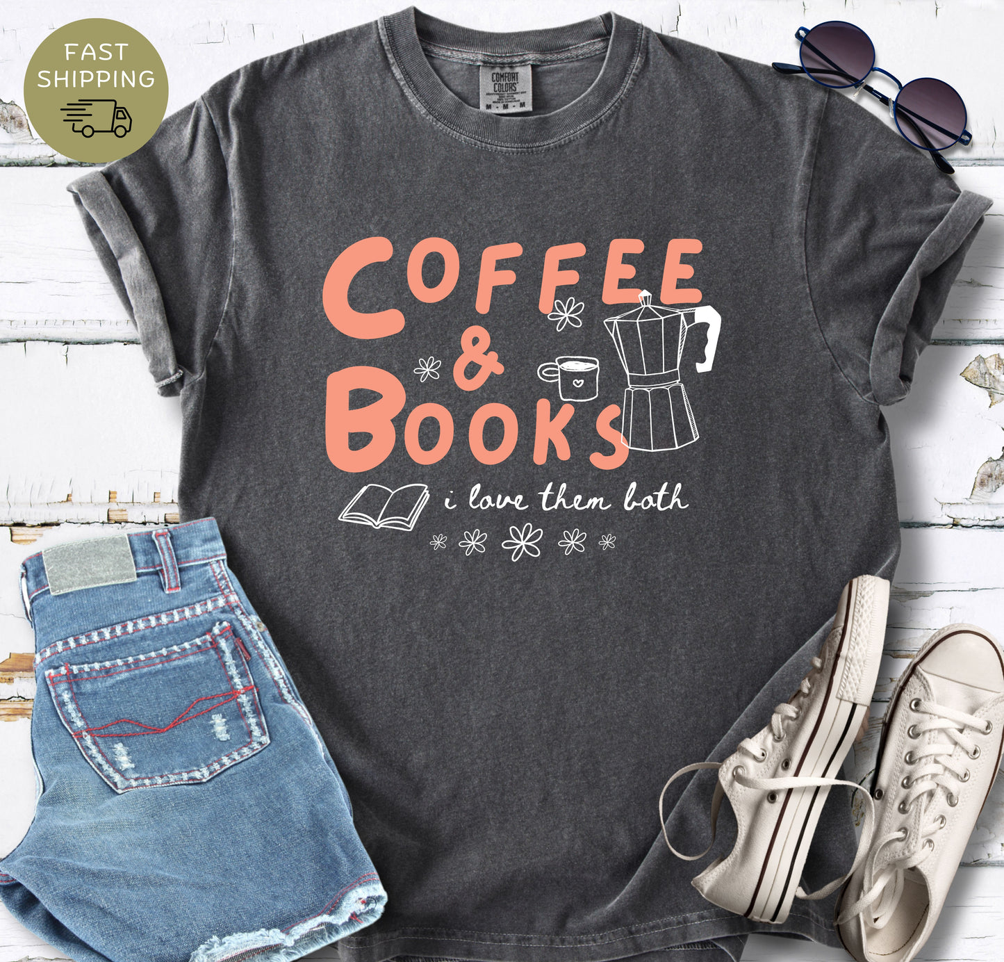 Comfort Colors reading shirt with “Coffee & Books” text and playful floral doodle accents.