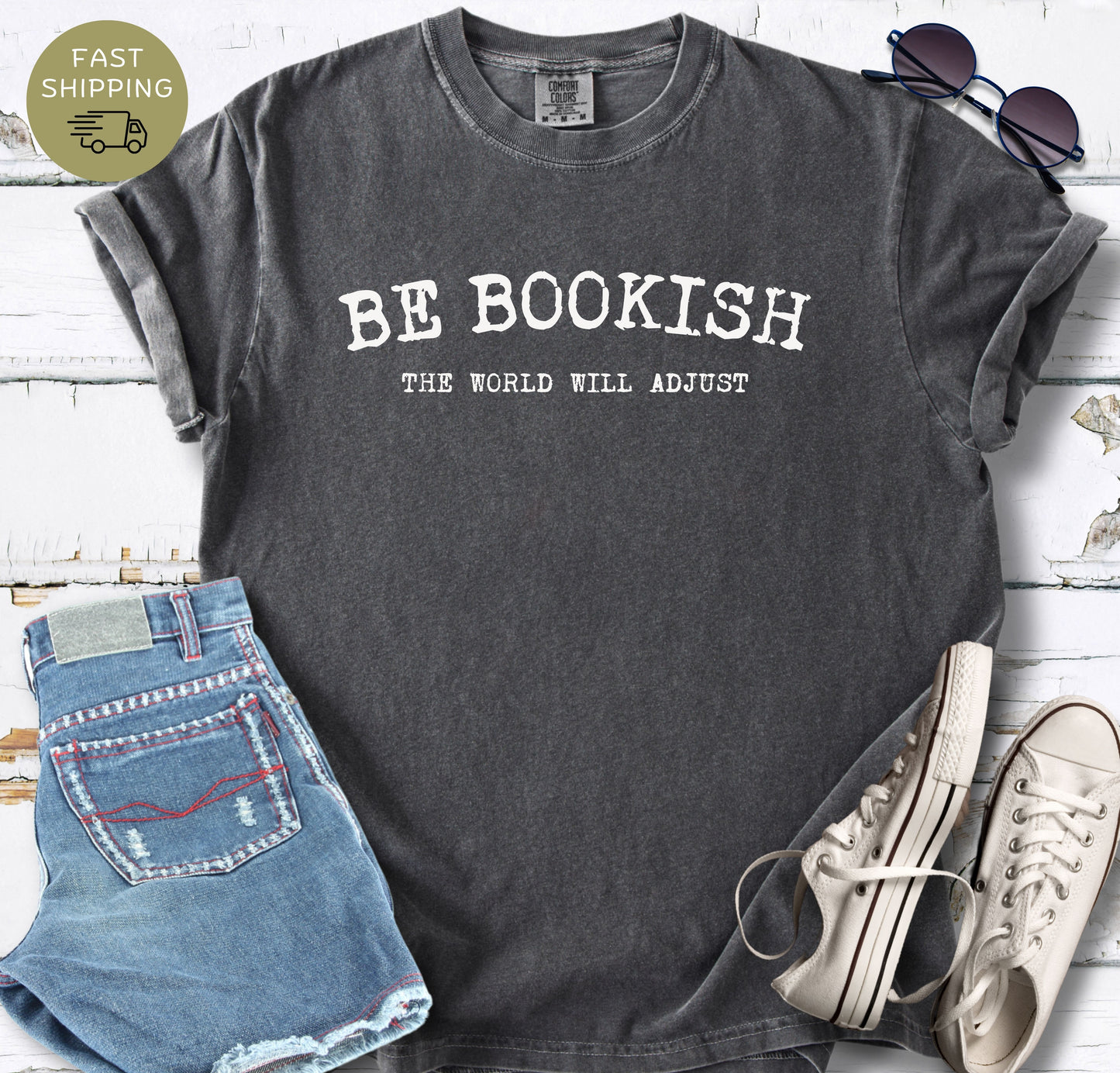 Pepper Comfort Colors t-shirt with white text reading Be Bookish The World Will Adjust.