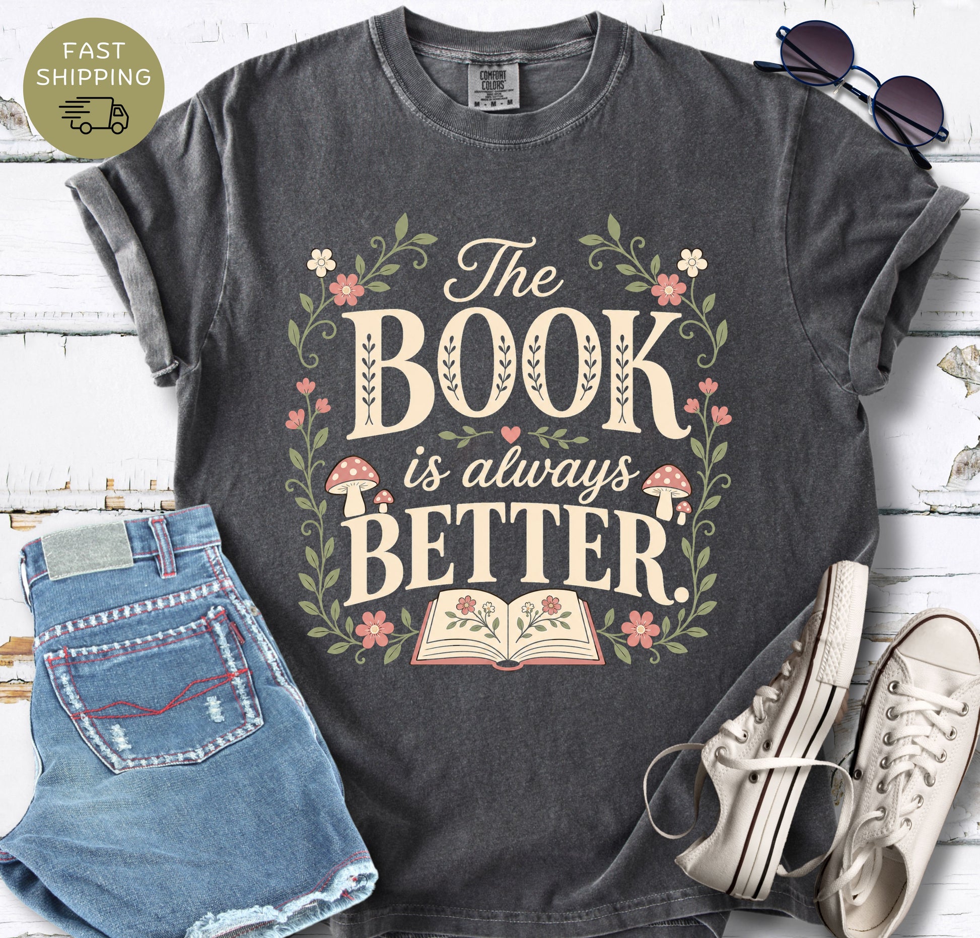 Pepper Comfort Colors t-shirt with “The Book Is Always Better” floral book lover design