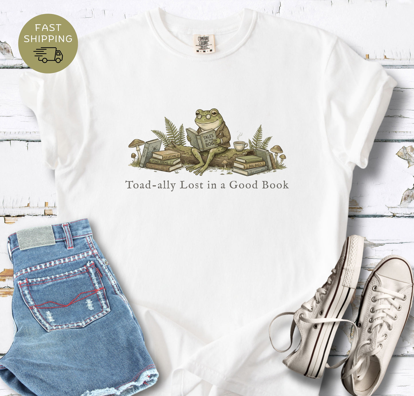 Bibliophile shirt featuring frog sitting with books and mushrooms