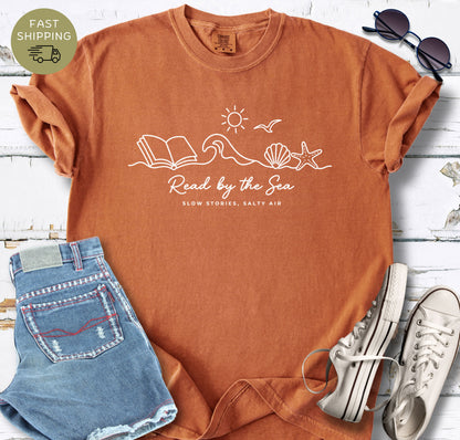Book lover beach shirt with starfish, seashell, and sun illustration